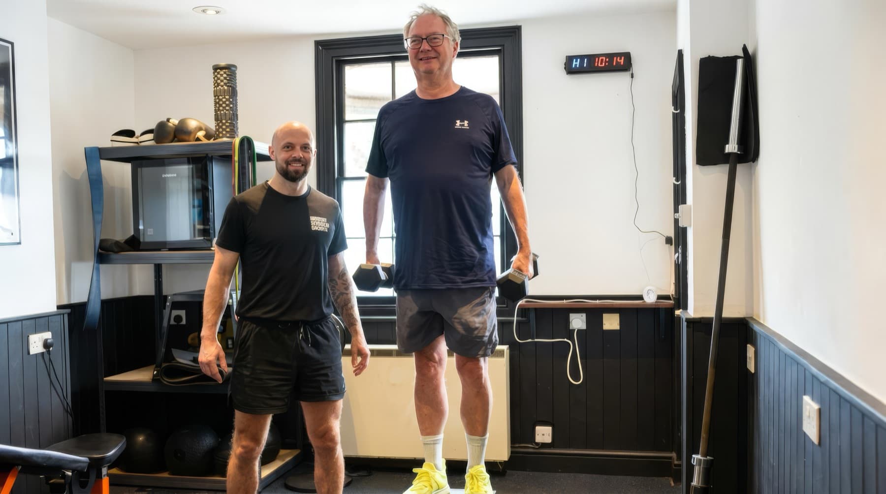 Michael Dennison with a client at the end of a session in his private Saffron Walden studio
